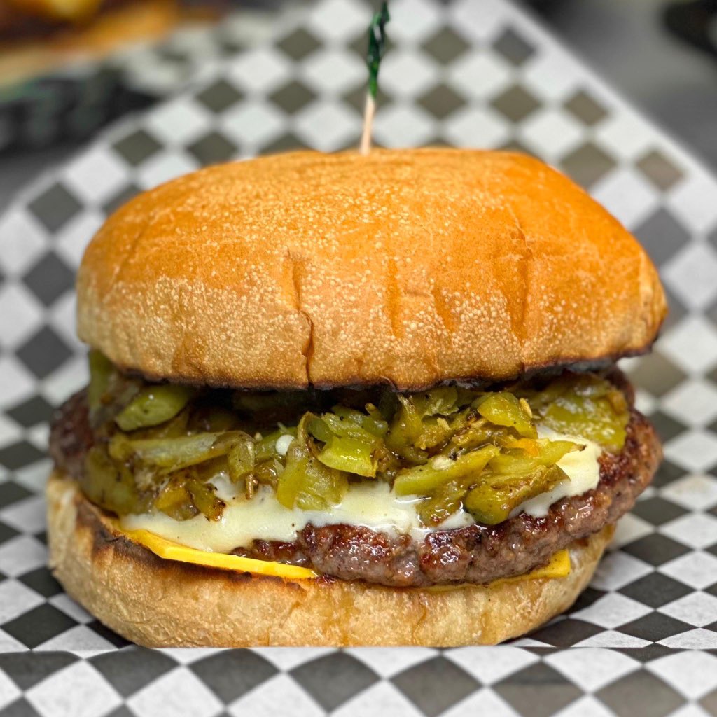 Meet your new favorite burger: the Hatch Green Chile Burger at Hubcap Grill!  🍔 Hand formed fresh ground beef patty topped with hatch green chiles, Swiss &amp; American cheese.