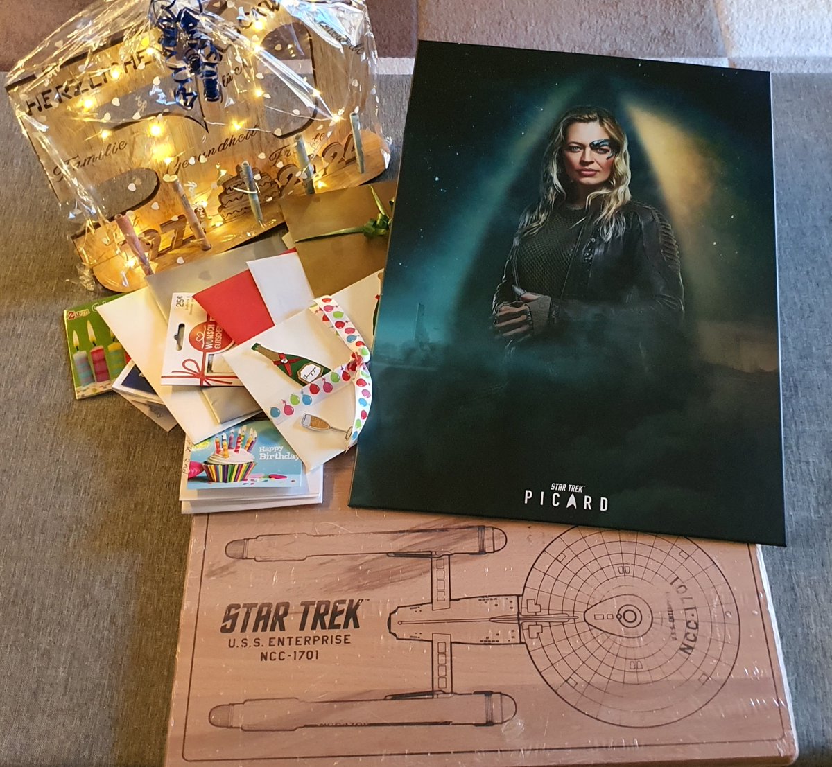 ErtlBianca's tweet photo. A few days ago I reached my half century. As you can see from the gifts and the huge banner, I probably don't need to come out as a Trekkie anymore😅. 
@JeriLRyan @DianaStr40 https://t.co/HZlsaNO6i9