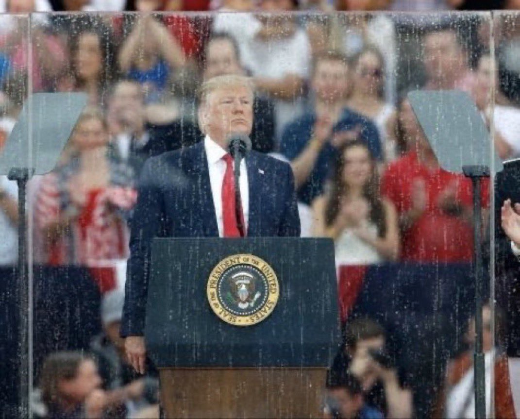 They’re going to pretty extreme lengths to protect his hair from the rain.