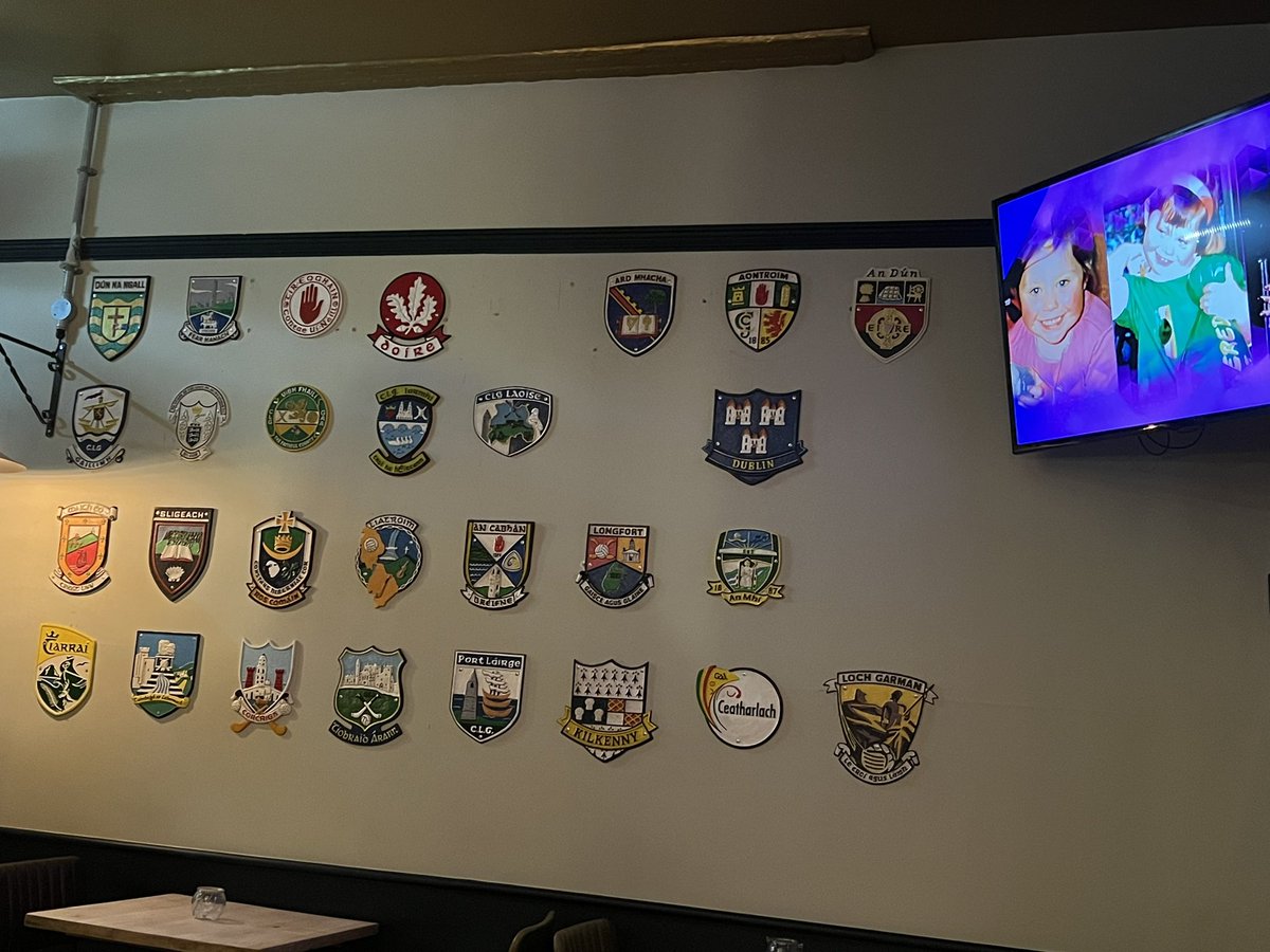 lilbitofamhran's tweet photo. An Armagh woman in an Armagh bar at the Hope Bar Fitzrovia, London watching the Rose of Tralee. All counties represented on their famous wall beside the telly. #roseoftralee 🌹 https://t.co/3qPqKVHGTQ