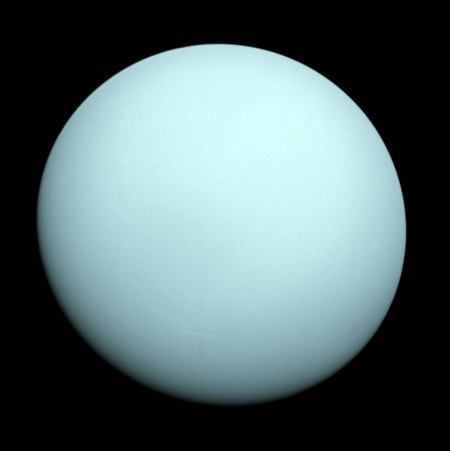 An image of Uranus taken by Voyager 2 as it passed by the planet in January 1986. The planet is a soothing icy green-blue color. The surface looks milky - most likely from its mostly hydrogen-helium atmosphere.