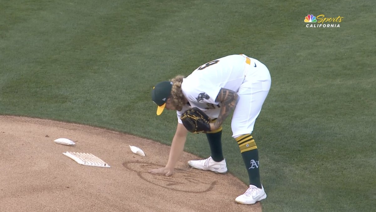 Joey Estes writes "Vinny" inside of a heart on the mound before his start today in memory of his brother-in-law, Vincent Gahret, who was killed in a multi-vehicle accident that involved a drunk driver, on Aug. 10.