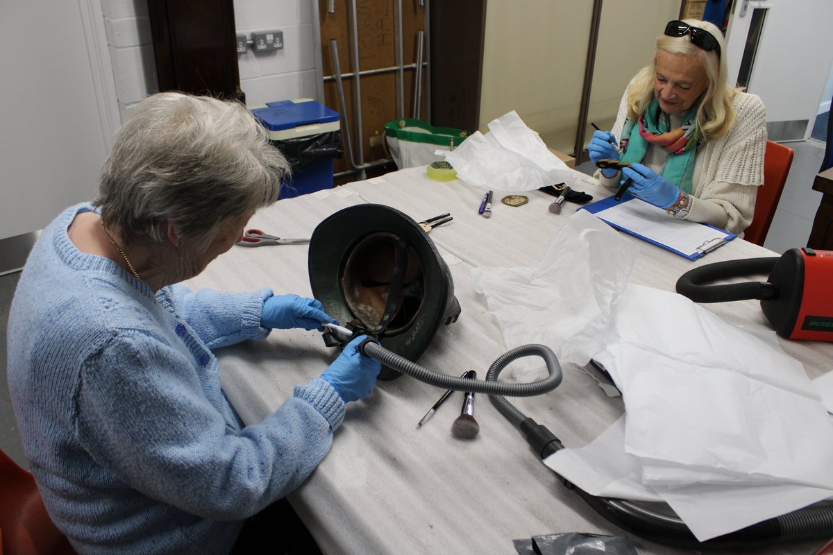 DoverMuseum's tweet photo. On #worldfashionday we thought we would look at some of the behind-the-scenes work with two of our volunteers who are undertaking important preventative conservation work on items from our textiles collection. https://t.co/8CCZFPFAJz