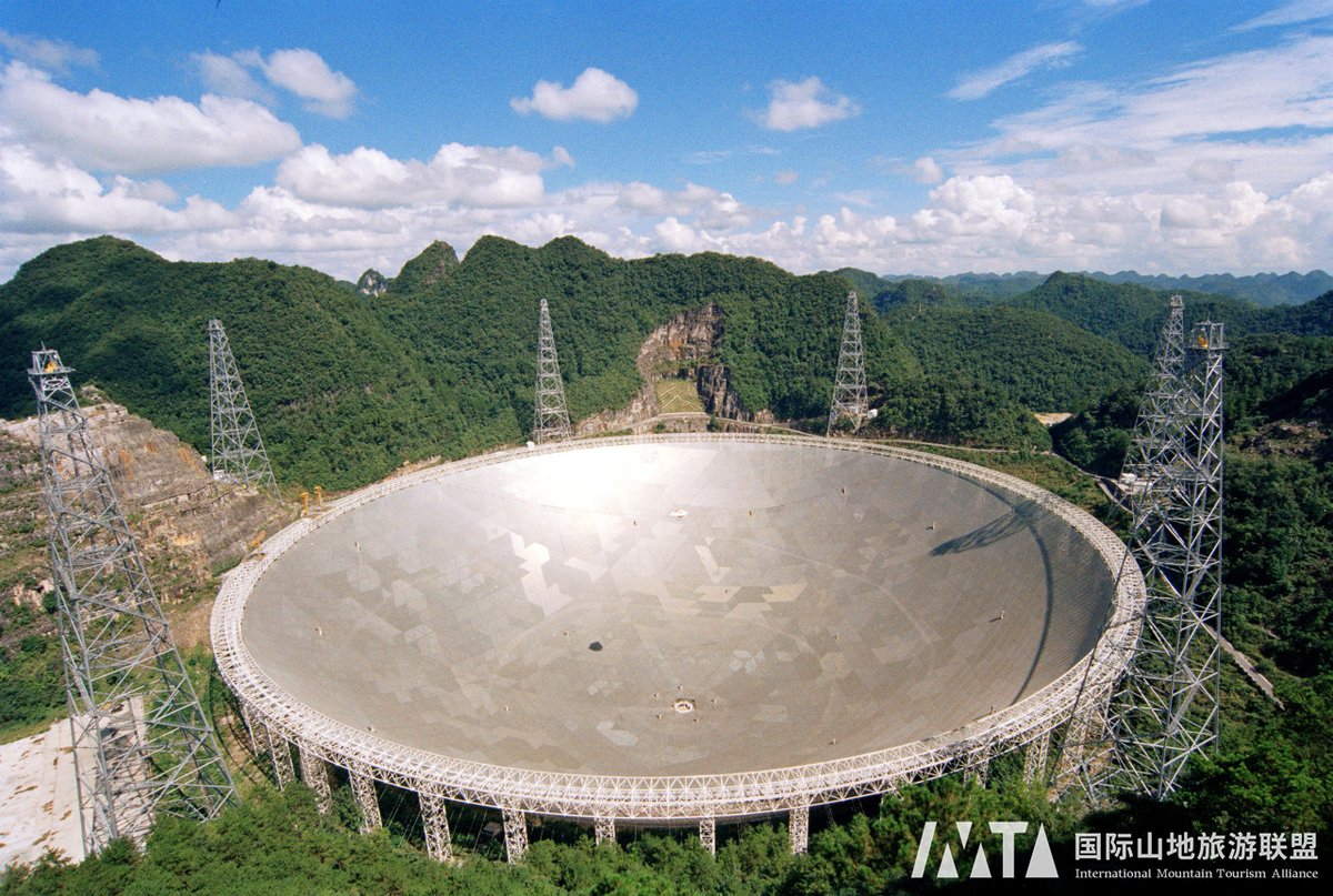 IMTAOFFICIAL's tweet photo. 🔭#Guizhou's "China Sky Eye": Unveiling the Mysteries of the Universe🛸

The "China Sky Eye," officially known as the Five-hundred-meter Aperture Spherical Radio Telescope (FAST), is located in #Pingtang County, #Guizhou Province, #China. It is the world's largest and most sensitive single-dish radio telescope, with a receiving area equivalent to 30 football fields. This giant "eye" captures radio signals from space like a radar, aiding humanity in exploring the universe more deeply.

✨Site Selection: FAST is situated in the karst depression of #Dawodang, chosen for its superior topographical, drainage, climatic, observational, and geological conditions. This location offers low construction costs, excellent drainage, suitable temperatures, minimal interference, and geological stability, providing ideal conditions for FAST's precise observations.

✨Working Principle: FAST uses its enormous parabolic surface to reflect and focus radio waves to a central cabin with various receivers. These receivers convert the radio waves into electrical signals for analysis and processing by the ground control center, revealing astronomical information about the universe.

✨Scientific Achievements: FAST has discovered over 740 pulsars, providing valuable data for studying stellar collapse, and detected mysterious fast radio bursts, illuminating mechanisms of extreme energy releases in the universe. Notably, FAST has detected several suspected electromagnetic signals from extraterrestrial civilizations, adding new hope to the search for alien life.

✨Practical Applications: Beyond scientific research, FAST can also work with active radar to enhance the accuracy of observing geosynchronous orbit objects, providing a safer window for space launches. It also shows enormous potential in near-Earth object warnings, helping to detect potential threats in advance.

The "China Sky Eye" Scenic Area in Pingtang County includes the International Experience Planetarium, the Observation Deck, and the Nan Rendong Memorial Hall, attracting visitors nationwide. As a mega project, the "China Sky Eye" represents a leap in China's technological prowess and provides powerful support for humanity's exploration of the universe and cosmic mysteries.

🖋Editor Ⅰ: Lucy
🖋Editor Ⅱ: Helen
🖋Editor Ⅲ: Liu Guosong

#IMTA #MountainTourism #ChinaSkyEye #FivehundredmeterApertureSphericalRadioTelescope #FAST #GuizhouProvince #PingtangCounty #KarstDepression #ScientificResearch #PulsarDiscovery #ExtraterrestrialSignals #SpaceExploration #Astronomy #TechnologicalAdvancement