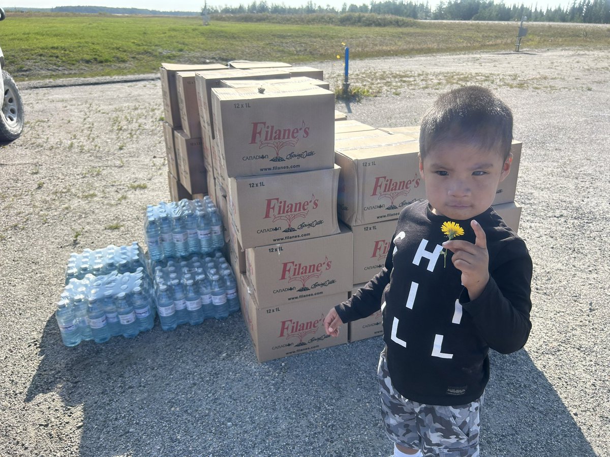 Three-year-old Preston Fox of Neskantaga First Nation stands near the latest water delivery from the federal government. Neskantaga has been under a boil water advisory for nearly 30 years. Little Preston has sores on his body from bathing in the water. He’s a beautiful, gentle,
