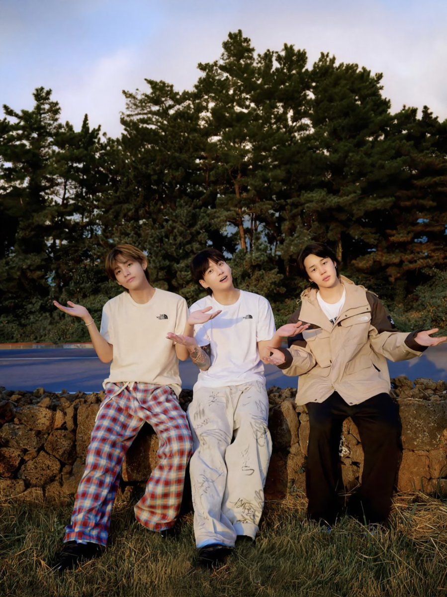 With the morning sunlight shining on us, my brothers Jungkook and Jimin and I are showing off our bare faces, fresh out of bed, taking in the crisp air surrounded by nature’s greenery.