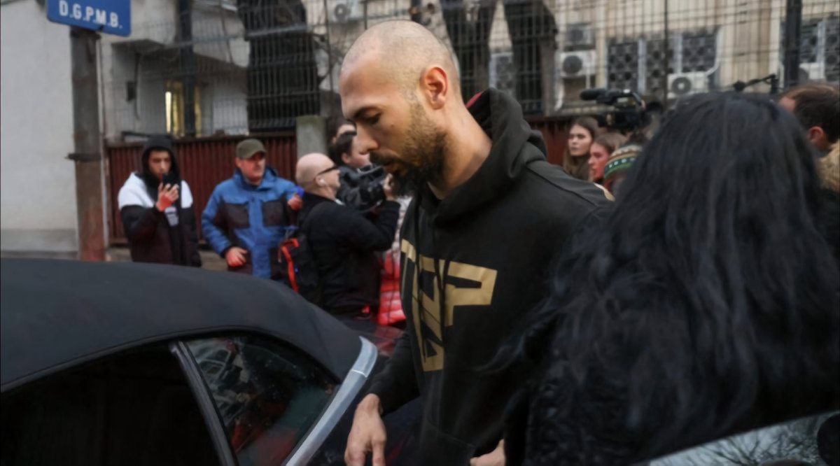 TRWOrganization's tweet photo. Andrew Tate being escorted to DIICOT headquarters by Romanian police. https://t.co/tVc5J2891u