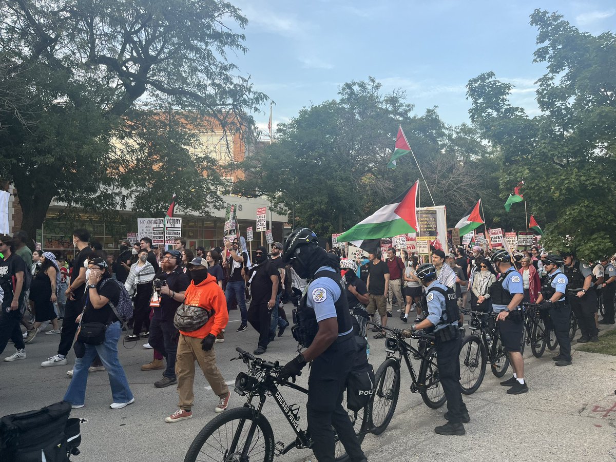 Protestors march towards the United Center, chanting “Not another nickel, not another time.”