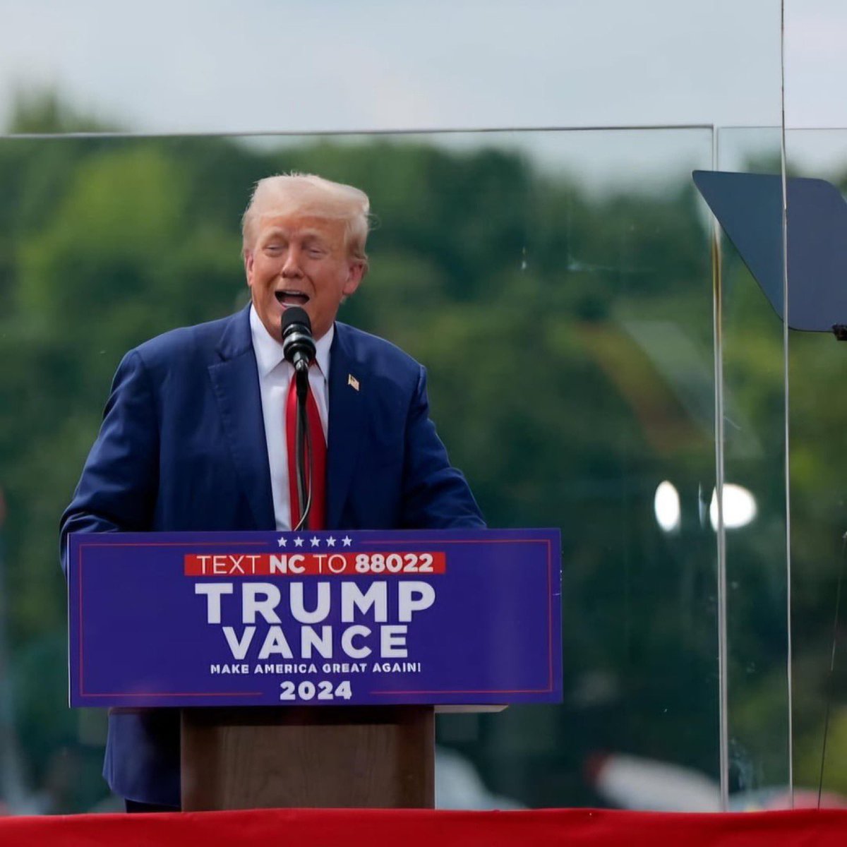 Pro-gun candidate behind bulletproof glass speaking to pro-gun supporters. Make it make sense.
