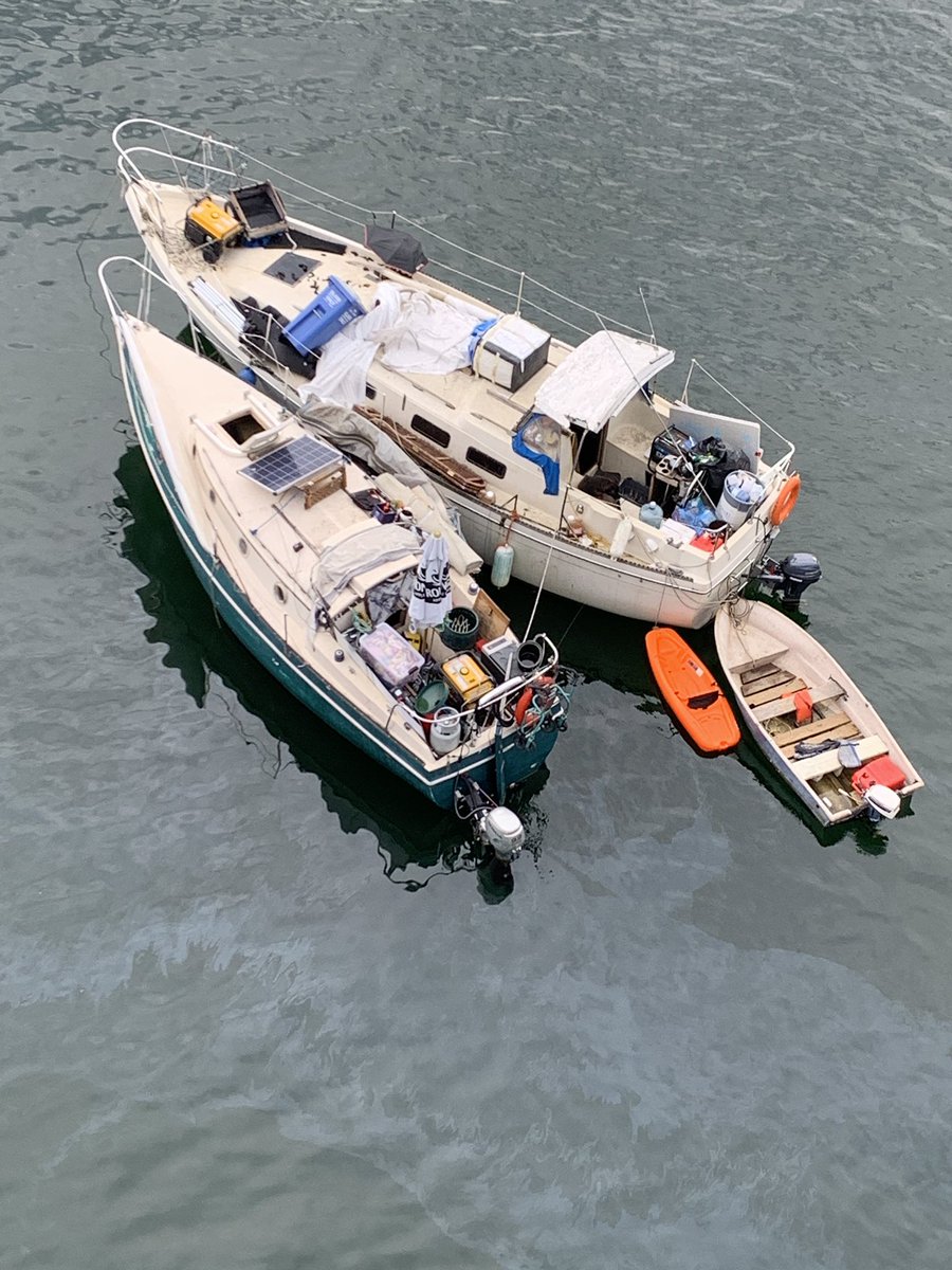CraigOliver64's tweet photo. Derelict boats leaking fuel in False Creek. Under the Cambie Street bridge. Abandoned dog in view.  #shameful. @CKNW @CBCNews @ckwx @CityNewsVAN @CoastGuardCAN @KenSimCity https://t.co/gHnkMgzhnn