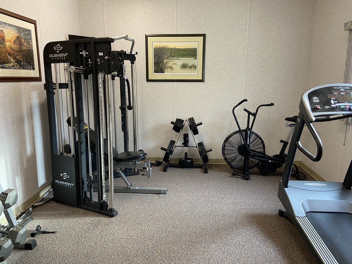 NoraltaZama's tweet photo. We just finished the upgrade to the fitness room. Fresh weight machine and a new cycle.  Not to toot my own horn, but I seem to hold the camp record for the biggest bench press.

#zamacity #pumpyouup https://t.co/bzbmsXIZik