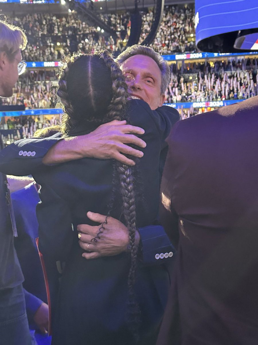 Dyann813's tweet photo. The hold on that hug. And listen to that crowd!!!!!  #olitz they delivered more than once at the #DNCConvention2024 https://t.co/kcSR5W6DFA
