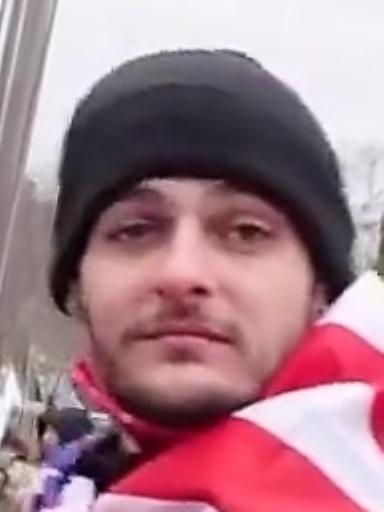 rocketman2001's tweet photo. Found him! #SpangledImp #FBI530 is wanted by the FBI for his role in the #Jan6 coup. He was involved in attacks on police on the west plaza & climbed on scaffolding to rally the mob. Imp was identified & reported in June 2022. Still waiting for @FBIWFO @USAO_DC to arrest him. https://t.co/TZYKeNGgT7