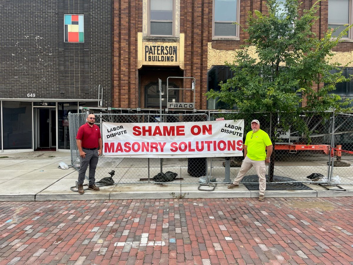 IUBAC's tweet photo. Field Reps Cris Fillmore and Greg Lobodzinski of BAC Local 2 Michigan were out bannering against Masonry Solutions again!
Better believe the banner did not have to stay up long before a meeting with a rep of the building owner was scheduled.
#ThereIsPowerInAUnion https://t.co/CnUvpqiF22