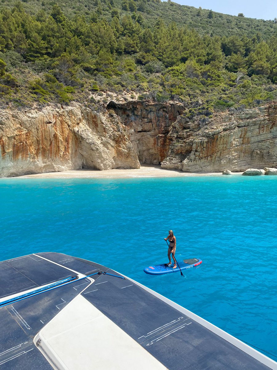 windelocat's tweet photo. Dreaming of escape, timeless moments & #BreathtakingLandscapes—aren't these the very reasons why our #sailors #HoistSails and chase the wind? On the west coast of #LefkadaIsland, Ellen & Christoph are enjoying a serene moment in a paradisiacal cove where nature reigns supreme. https://t.co/LCyaqWXFP9
