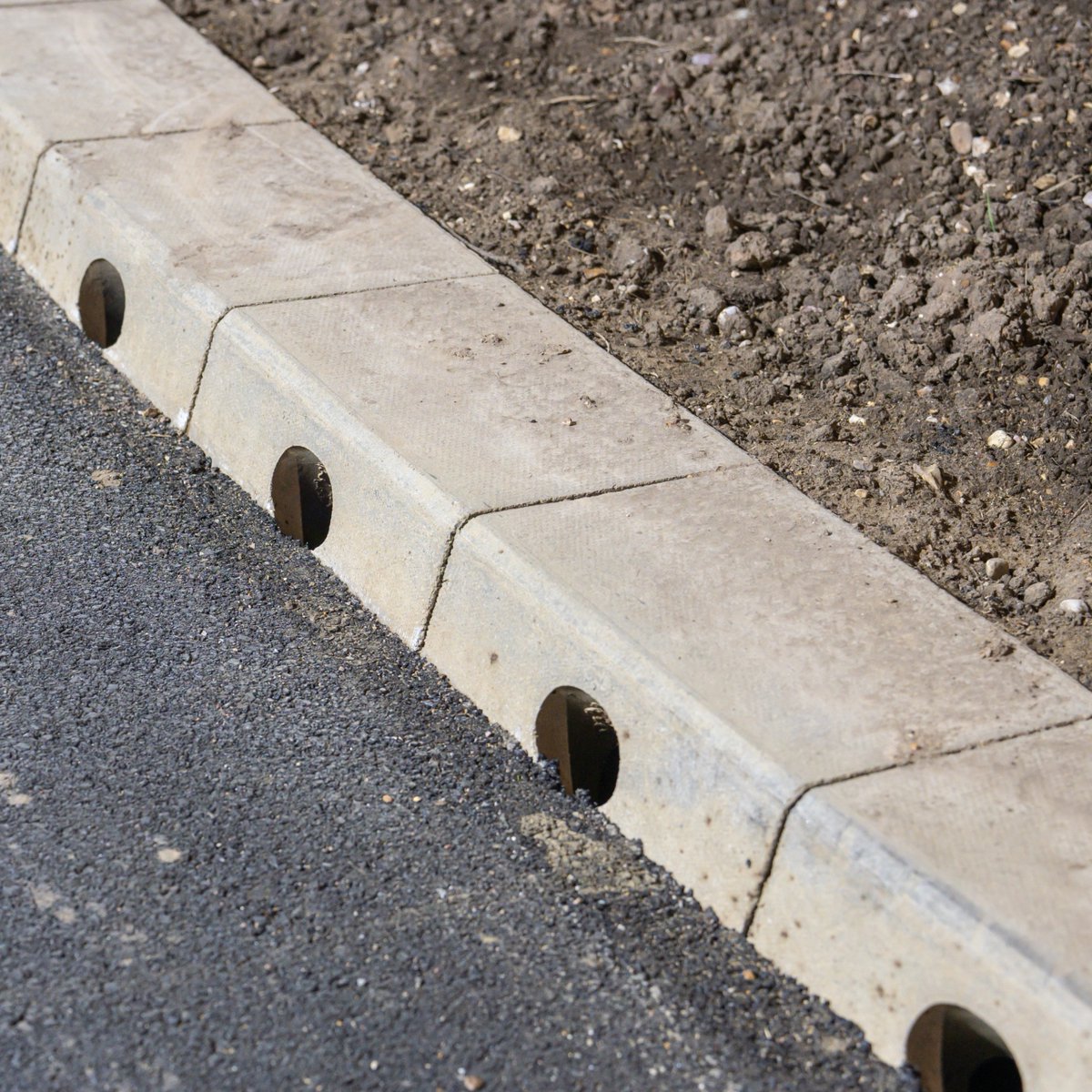 WNSurfacing's tweet photo. These kerb drains will help avoid flooding and high levels of surface water which can be dangerous. Our job is to make sure that the road surface laid does not obstruct them while remaining smooth and level. https://t.co/sJs2GA6fYA