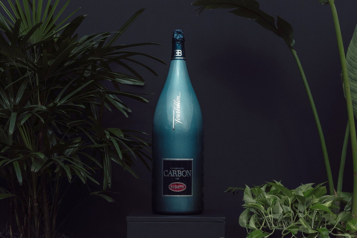 Bugatti's tweet photo. The TOURBILLON made a stunning US debut at Monterey Car Week, and to celebrate and honor it, BUGATTI's partners designed exclusive Lifestyle items, including the   Bugatti Tourbillon timepiece by Jacob & Co, a 15-liter Champagne Carbon bottle, and a bespoke Bugatti Baby II. A perfect tribute to Molsheim's  latest masterpiece.

#BUGATTI #TOURBILLON