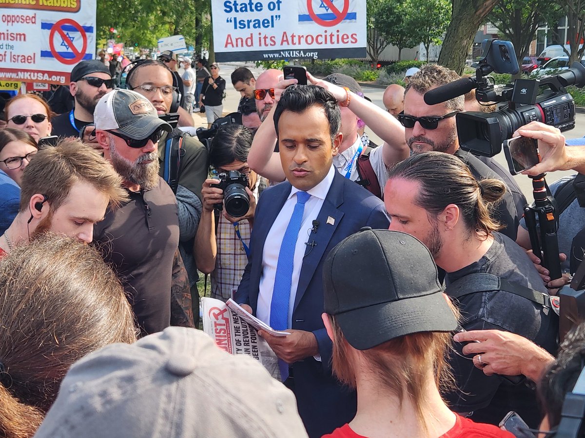 MourningWoodCo's tweet photo. The Press was insane, but I somehow managed to get right between Vivek and a Communist spokesperson. 

#DNC2024CHICAGO https://t.co/wt5CjccLH5