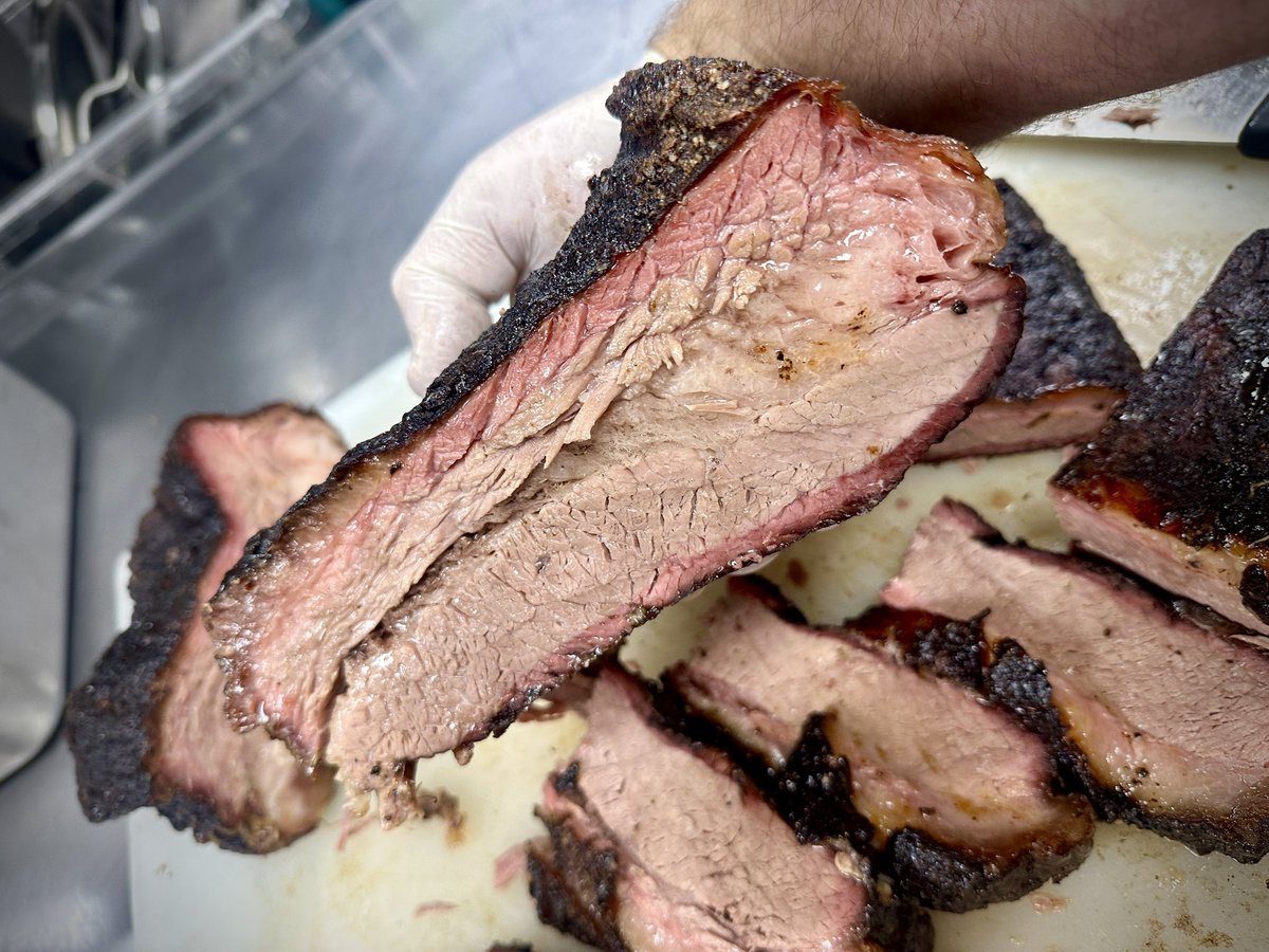 Cutting SLABS tonight! Smoked Beef Briskey came out excellent! Russ has a sweet and spicy hatch chile drip sauce we’re gonna slather these babies with and pair it a good ole summer tater salad amped up with a few of our pickled garlic scapes and some loup garou!! Let’s GEAUX!! 🤩