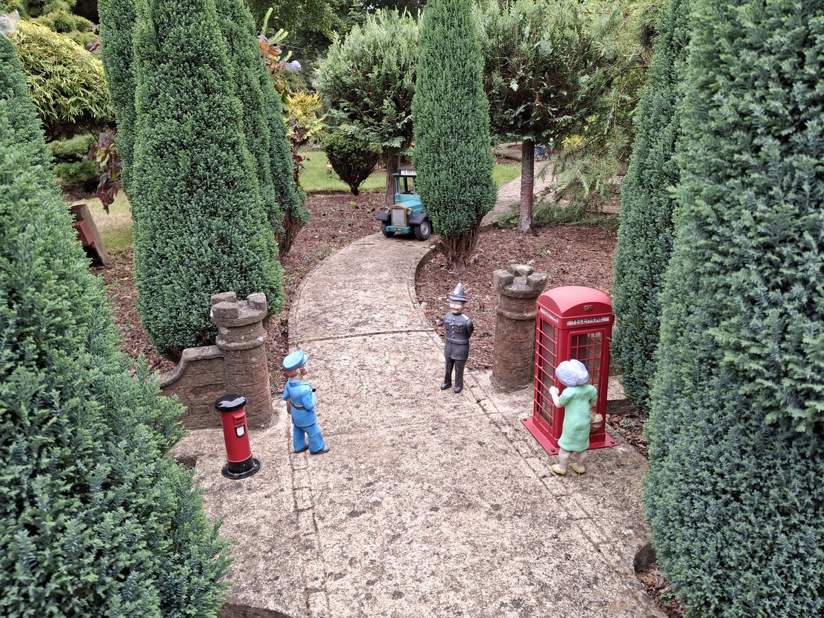 Liz_Kentish's tweet photo. In Godshill model village on the Isle of Wight,
Stand two tiny postboxes, a charming sight.
1/10th scale models, all red and bright,
Bringing joy to all, day and night.

#postboxSaturday 📮✉️📝💜 https://t.co/wdhCFrjBig