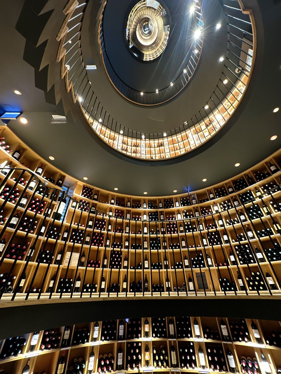 MoutonIsAClaret's tweet photo. A wine shop with a spiral wine staircase. https://t.co/nSLw6itW4B