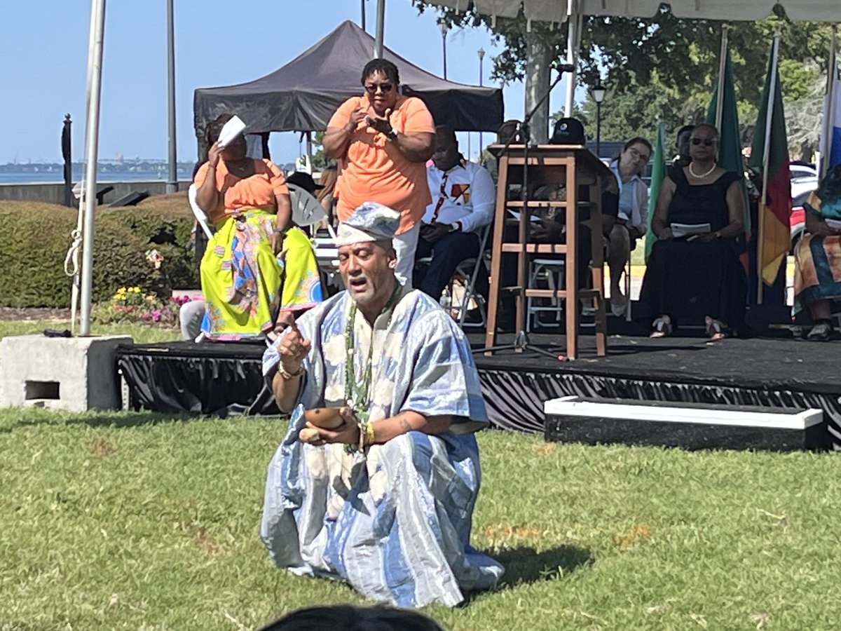 In honor of the Africans brought to Fort Monroe in 1619, hundreds gathered for African Landing Day to remember them with a libation ceremony, by tossing petals in the water and celebrating the culture of Angola where the ship sailed from. ⁦<a href="/FtMonroeatOPC/">Fort Monroe at Old Point Comfort</a>⁩, #Africanlanding