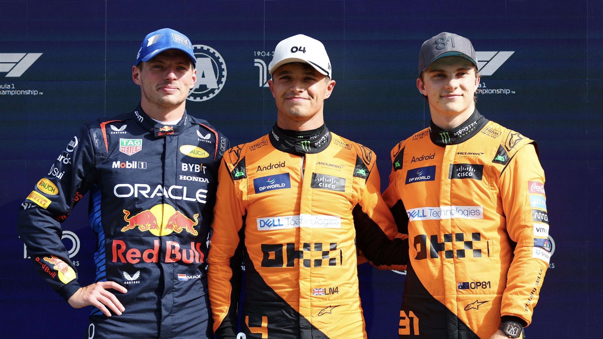 Max Verstappen, Lando Norris and Oscar Piastri pose together for a photo after Qualifying at the Dutch GP, 2024.