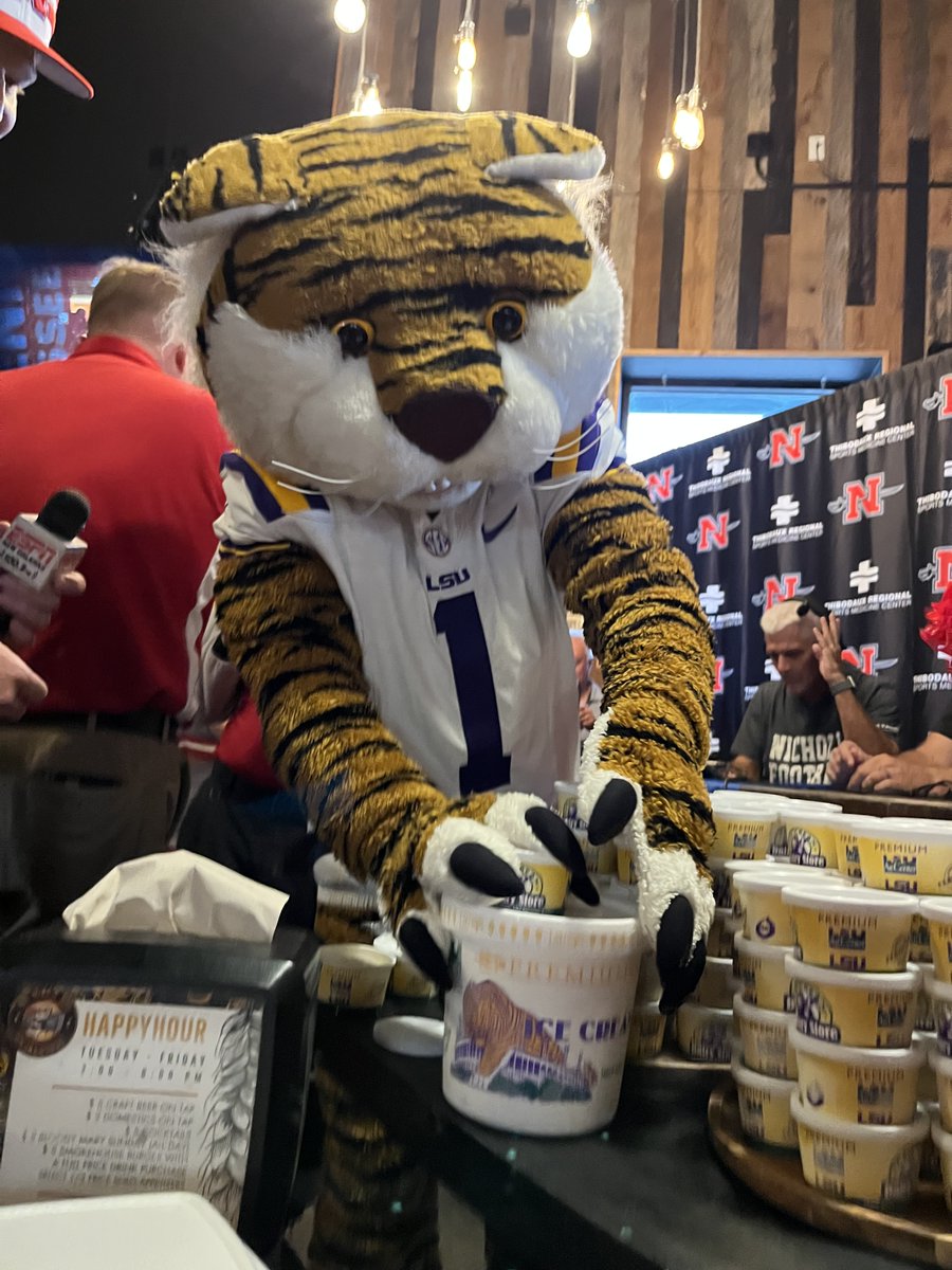 LSU's tweet photo. Have you heard the news? 

The @LSUAgCenter Dairy Store has a new @NichollsState-inspired ice cream flavor, and it will be available for purchase prior to the @LSUfootball game vs. Nicholls!

🍨 Saturday from 10 am to 4 pm
🍨 Outside the Dairy Store located at 118 S Campus Dr.
🍨 The new Nicholls-inspired ice cream flavor made its debut earlier this week when @lsumiketiger made a special delivery to our friends in Thibodaux.