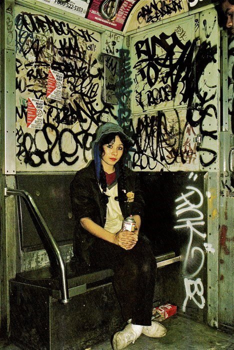 DrinkSolaPop's tweet image. New York City (1981/1982). Lady Pink, an Ecuadorian graffiti writer from Queens, poses on the train with her tag, and in the bathroom of Art &amp;amp; Design High School, her alum, with Mare 139. Photographed by Martha Cooper.