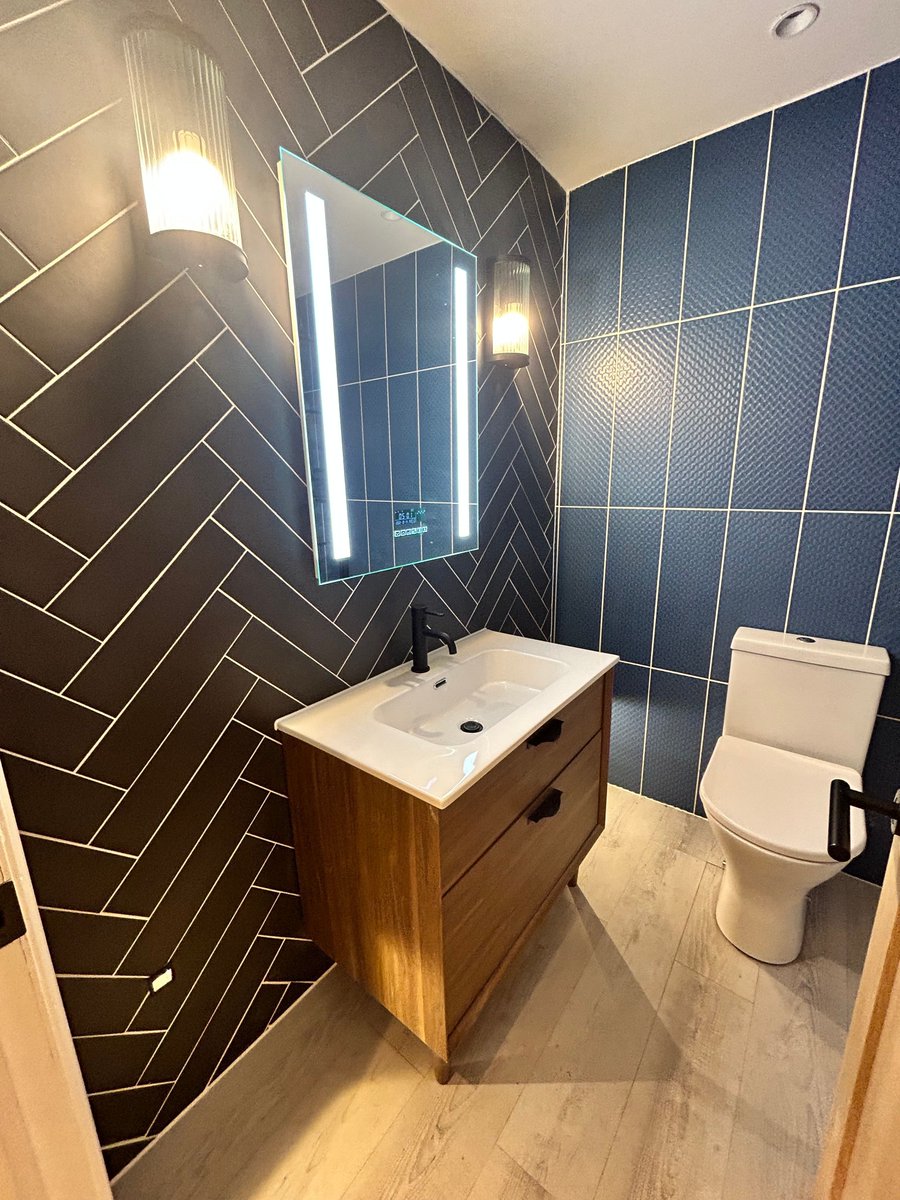 The bathrooms in our development Villa Esplanade are a standout feature. This apartment has beautiful blue wall tiles. The calming blue hues create a serene ambience. 
#VillaEsplanade #Scarborough #Propertyinvestment #Holidaylets #Intercountyhomes
