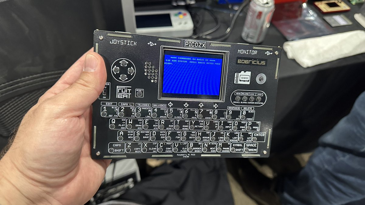 whatskenmaking's tweet image. If anyone wants to try out the #misterfpga portable, I’m over at @benheck’s table. Brought a good selection of #tapto cards, and the PicoZX loaded up with C64 as well #vcfmw