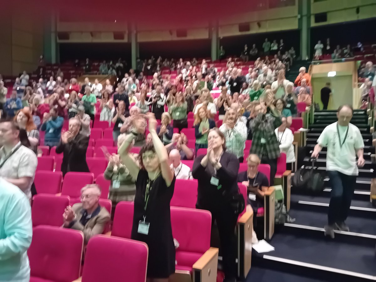 Tom___Scott's tweet photo. Zane's Law on identifying &amp; remediating dangerous toxic landfill sites passed unanimously by @TheGreenParty conference! Great moment after years of tireless campaigning by Zane's parents Kye &amp; Nicole.

#GPC24 gives Kye a standing ovation as he thanks @natalieben &amp; other Greens. https://t.co/BsmUeJdXrZ