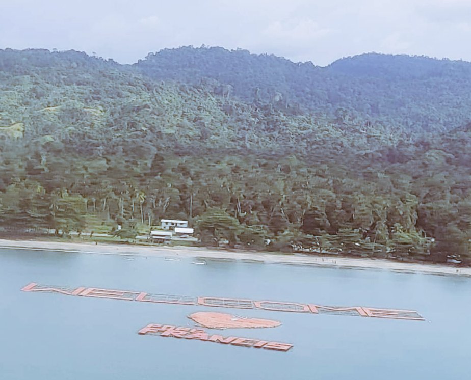 Welcome #Pope #Francis this floating sign says at the waterfront in #Vanimo #PNG . His Holiness will be arriving in town shortly for celebration of the Holy Eucharist with the faithful today.