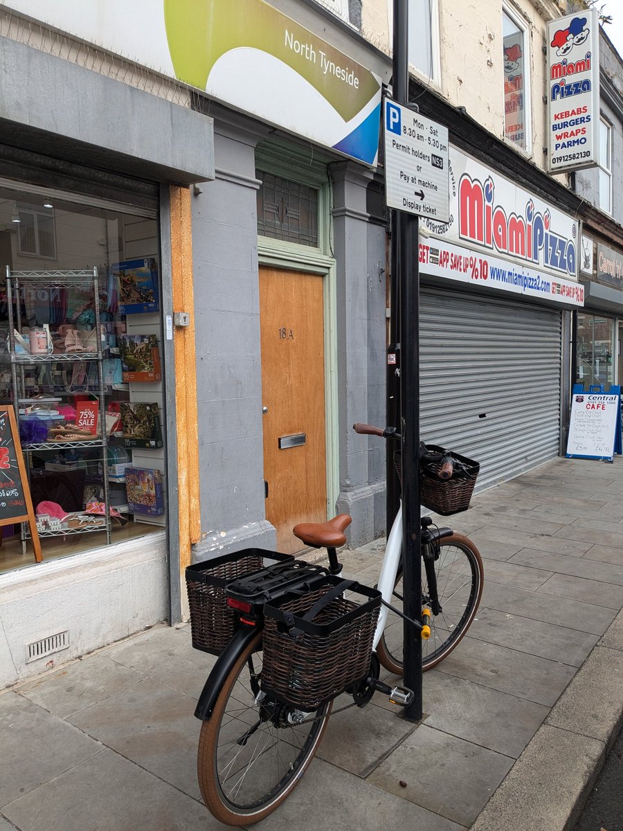 A lovely ebike with wicker basket style panniers on the streets of North Shields. The owner, a graceful and elderly rider doing her business on a Saturday morning - active, mobile, net zero and full of spirit.