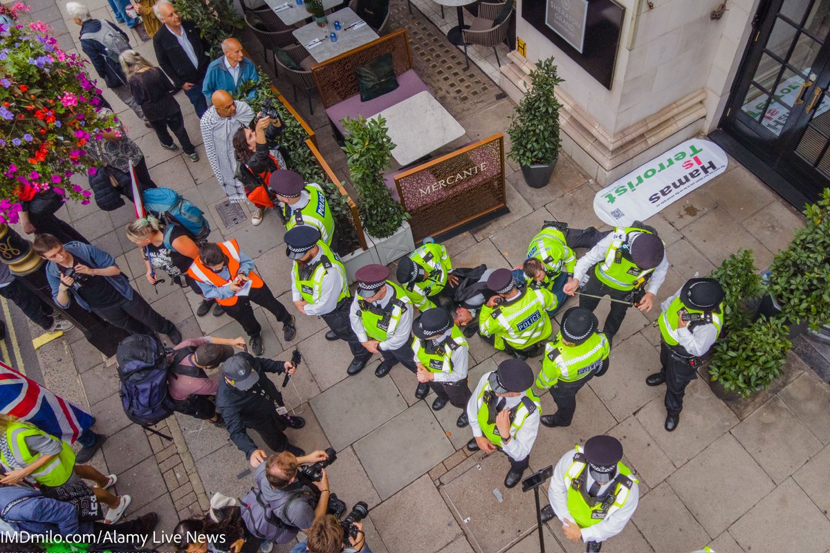 GhorbaniiNiyak's tweet image. Yesterday, despite having court permission to attend a pro-Palestinian (Hamas) rally with a sign that said "Hamas is a terrorist," my friend Mark and I were brutally arrested by the police. The police were entirely focused on removing us and hiding our sign, while several people…