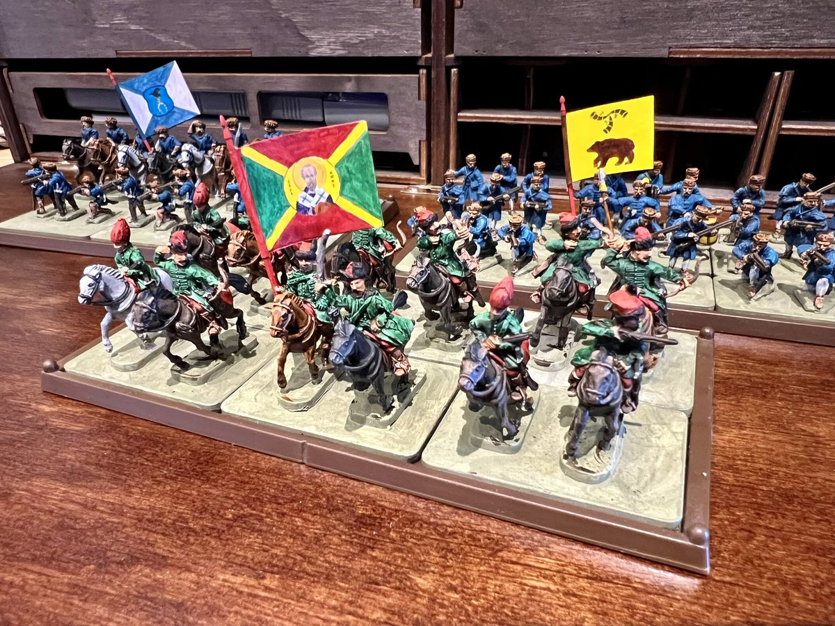 khaiell's tweet image. Another week, another 15mm XVIIc unit. This time it’s Wallachian light cavalry. As they came out so Christmassy green-red, I made them a bespoke St. Nicholas banner. Good quality pictures coming once I do bases.