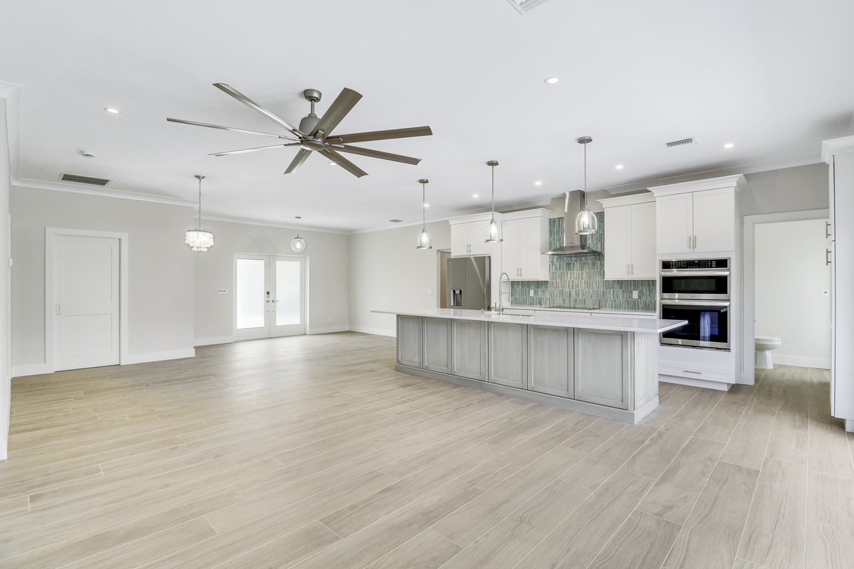 We love a wide open floor plan in our design builds. This kitchen, living room, dining room space turned out great. More pics on our website.
