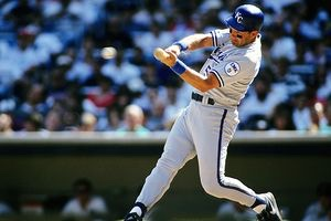 If a coach tells you to get into your legs.
This is what it looks like.
Notice-piping on back thigh angles back.
Chest behind waist.
Hitting against firm (inverted front knee).
Put on pants with piping and get into this position in front of a mirror. 
Feel it.