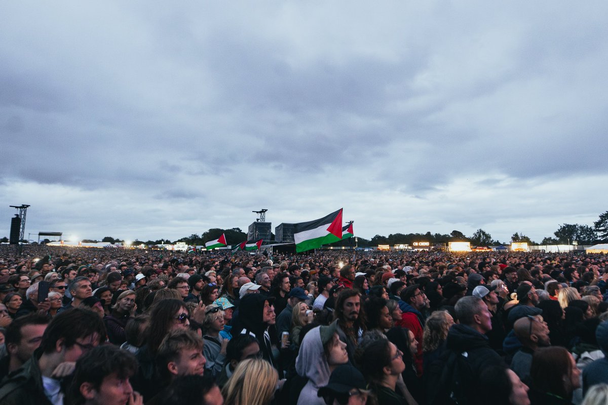 motazazaiza9's tweet photo. Motaz & Massive Attack in front of more than 35,000 people.

As I said, Im using every way to tell&show the world the reality.

I will use the camera, music, art and each stage I can reach to tell you about the genocide and what Israeli occupation is doing.

Unfortunately millions from the world now know but it changed nothing.

Im continuing doing what I do, at the end its for the Country, for the people, for Palestine 🇵🇸 

Thank you @massiveattackofficial again for standing on the right side.