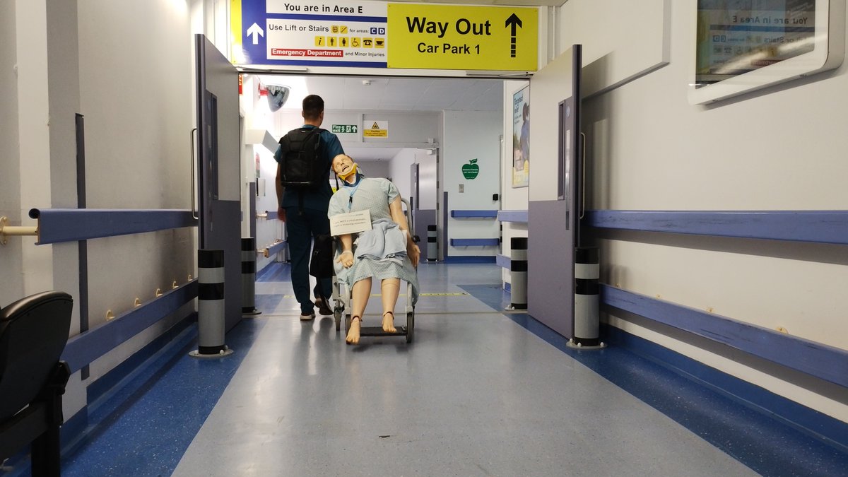 NGHSim_Resus's tweet image. Just in case you were wondering how our Sim Man gets from A to B @NGHnhsTrust, here&apos;s Jay the tech giving him a helping push! #healthcaresimulation #insitusimulation #pointofcaresimulation #simman #nhs #medicalsimulation #Northampton  #NorthamptonGeneralHospital #NGH