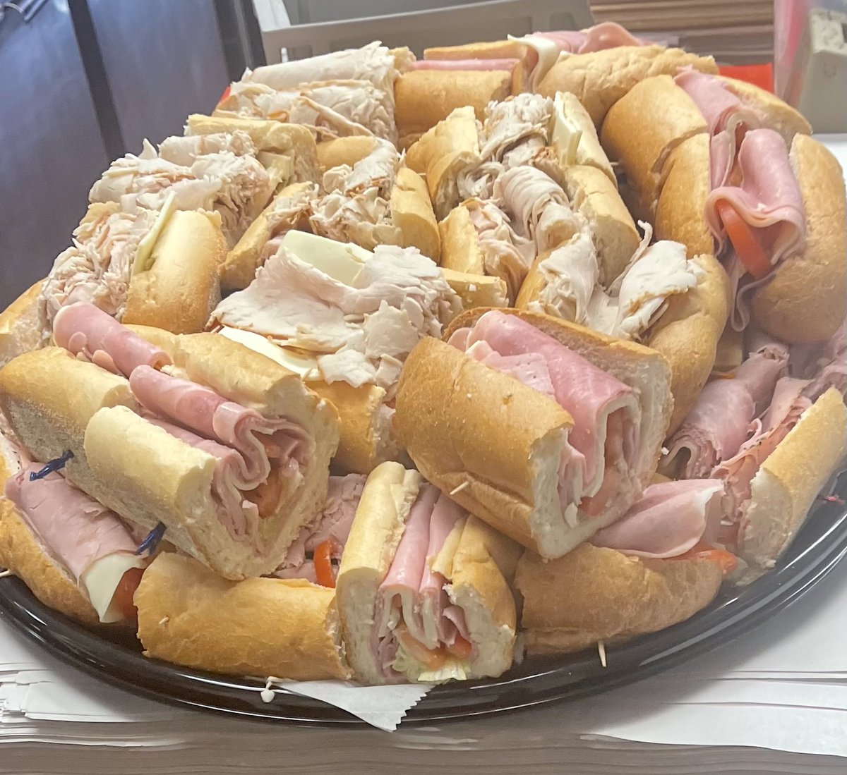 Yes, we do cater!  Any  of our menu items and of course we do hoagie trays too !
romanostromboli.com