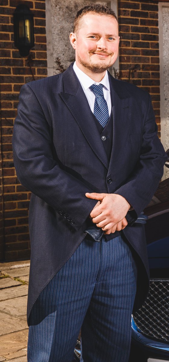 Our funeral conductors are dressed impeccably for the occasion in formal dark navy tails with a delicate stripe running through, complemented perfectly by lighter blue striped trousers and a navy spot tie. Russell and Bede bear show off their distinctive attire with pride. #Hurst