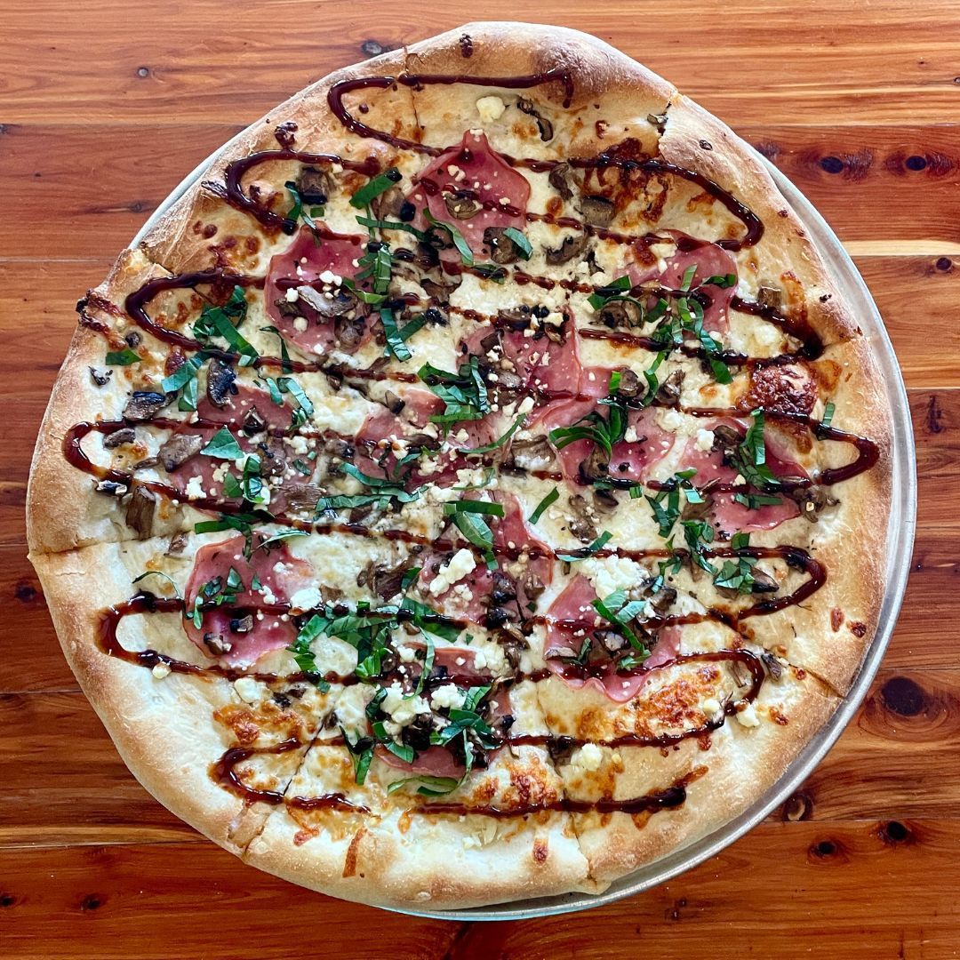 The Fancy Free!  Olive oil, shredded mozzarella cheese, mushroom, garlic, goat cheese, Canadian bacon, basil &amp; balsamic reduction.
