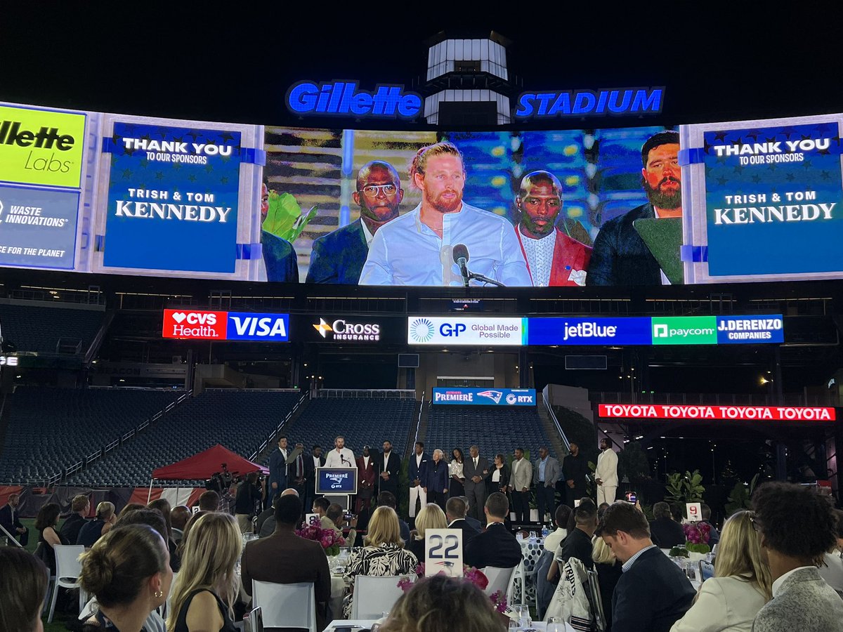 Brenden Schooler shares remarks after being presented the 2024 Ron Burton Community Service Award at the Patriots Premiere.

Schooler is joined on stage by Robert Kraft, past winners and the Burton family.
