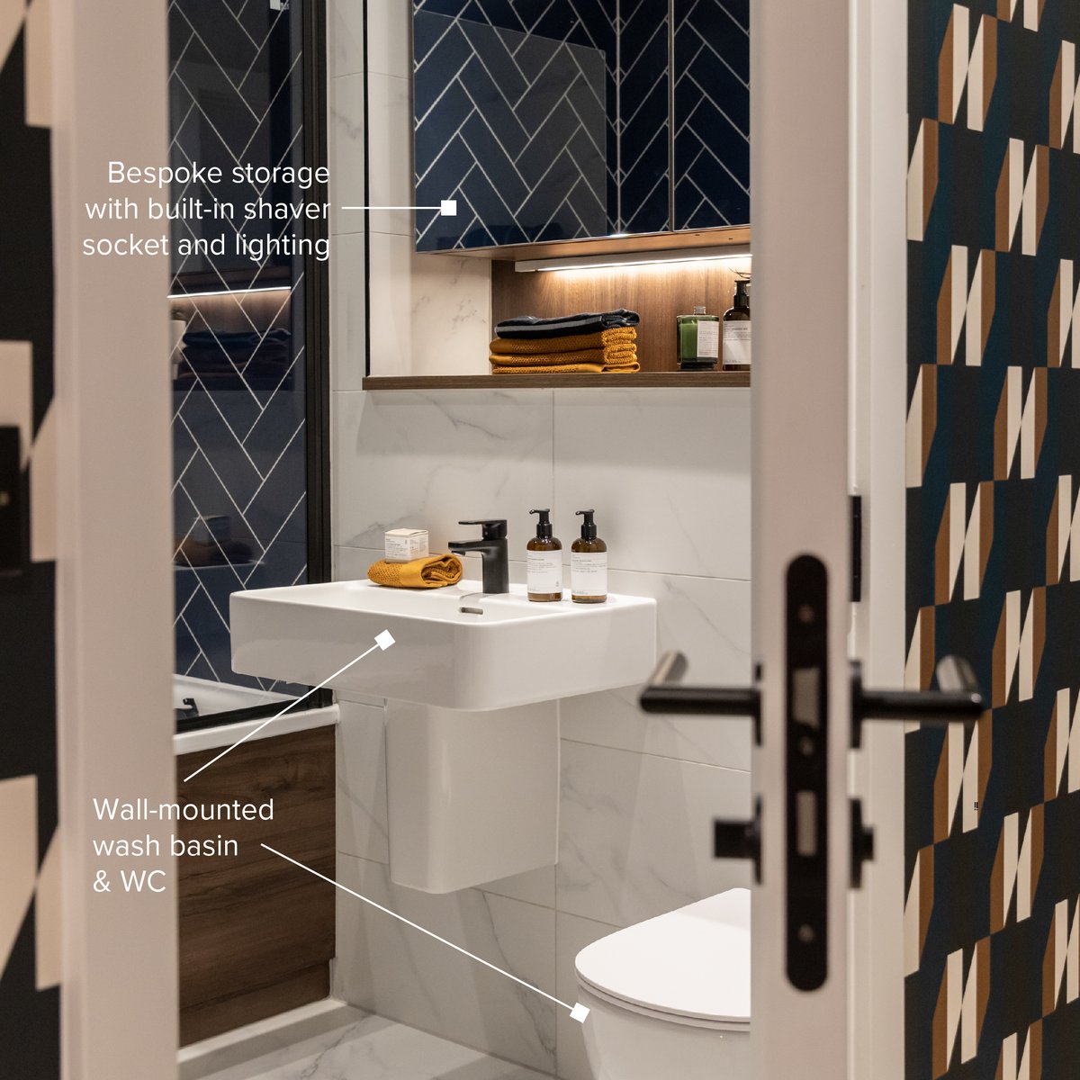 Each bathroom at Bankside, Colliers Yard is designed to offer a seamless blend of style and functionality.

Fully tiled with distinctive navy metro tiles and accented by sleek black Hansgrohe fixtures, featuring a luxurious rainhead shower. Each bathroom is set to create a serene