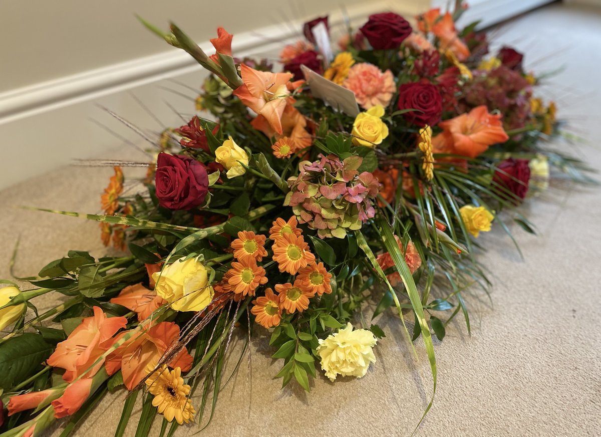 The second of August's birthflowers (the first being the poppy) is the gladiolus, seen here to great effect in this warming late-summer arrangement. Available in a wide range of colours, these showy blooms are bound to steal the show! #Gladioli #FuneralFlowers