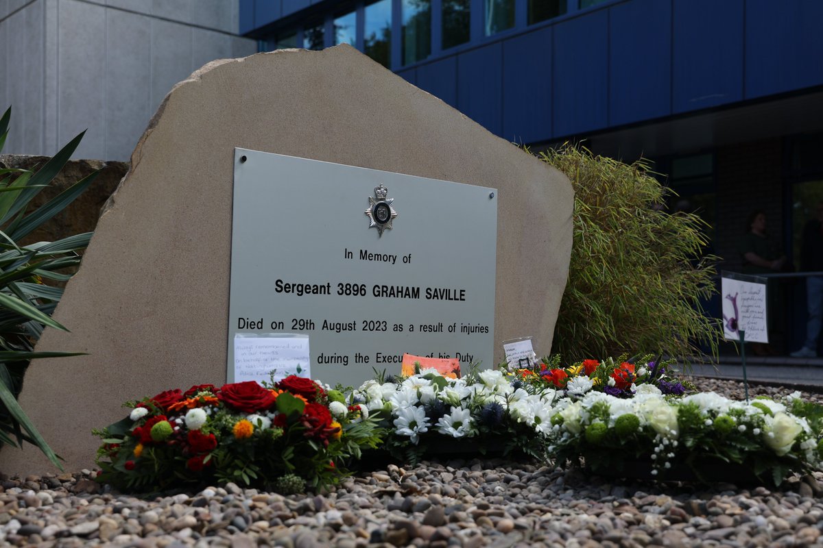 Colleagues, friends and family stood together in silence this afternoon in remembrance of Sergeant Graham Saville, who died one year ago today.