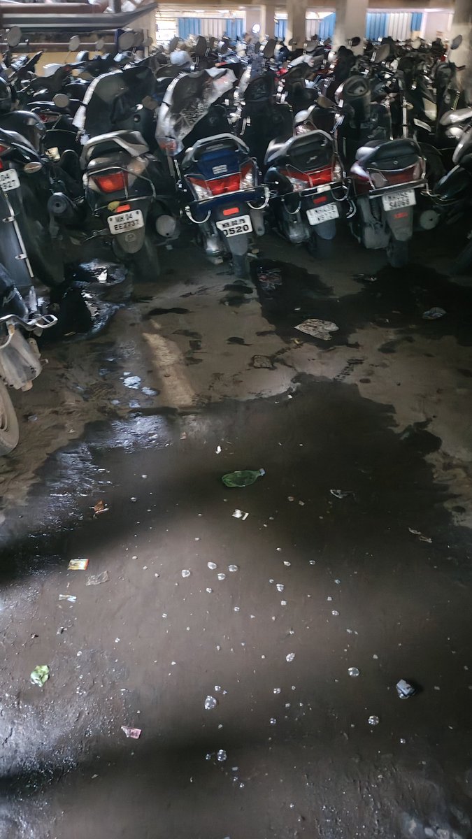 RoadsOfMumbai's tweet photo. This is not an abandoned or haunted place, but a paid parking lot next to Thane Station, PF 1.

Literally pitch dark, lights not working.

People using their phone torches to find their 2 wheelers.

Garbage and puddles everywhere.

Bikes parked like sardines, and the staff manhandles the vehicles extremely roughly.

Also the bikes are parked on the sloping route to higher floors, leaving no space to even provide a turning radius for 2 wheelers to easily exit the parking complex.

TMC and Thane Fire Brigade should do an audit once to check if this is safe.

But who cares? Authorities will wake up once a tragedy happens.

Tab tak chalta hai, chalne do.