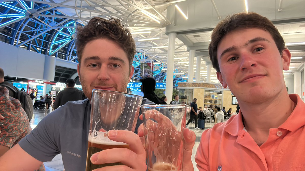 routh_max's tweet photo. Despite our smiles in this photo, it is out of spite for @AmericanAir. These guys are bums. Flights switching back n forth. Make up your mind! These airport beers are the only thing stopping me from jumping the gate agents. #maybefrontierisbetter https://t.co/o76CDGHz1O