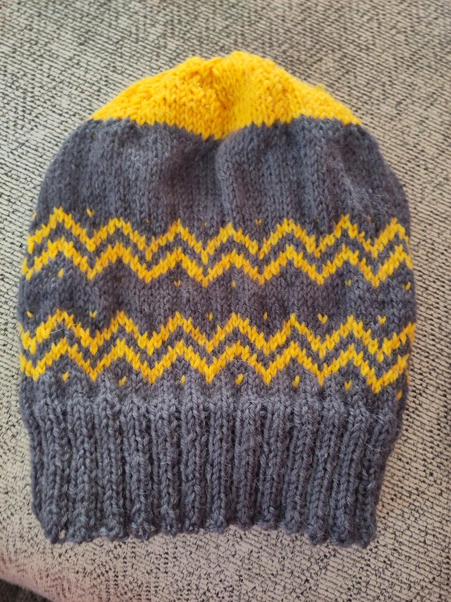 Knitting on gas. Pattern from Jo allport's 10,000 hats, a bit of zig zag fair isle in batman colours for my Marvel-ous brother . Couldn't bring myself to knit in black so grey will have to do!